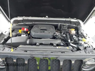 2022 Jeep Wrangler Sport S z VIN 1C4GJXAN9NW124190, wystawiony jako IAAI lot #42027247 z przebiegiem 8 376 mil mil oraz . Historia ofert i sprzedaży dostępna na DreamBid. Obrazek 10.