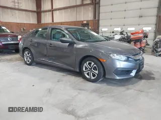 2016 Honda Civic Sedan LX with VIN 19XFC2F58GE214672, listed as a IAAI auction lot 42067792 with 73,929 mi miles. Bid and sale history available at carsss.com. Image 1.