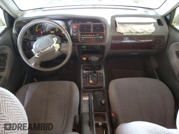 1999 Suzuki Grand Vitara JLX z VIN JS3TD62V3X4123048, wystawiony jako Copart lot #73007124 z przebiegiem 159 828 mil mil oraz Szkoda całkowita • Salvage title. Historia ofert i sprzedaży dostępna na DreamBid. Obrazek 8.