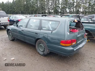 1996 Toyota Camry LE z VIN 4T1EF12K9TU116427, wystawiony jako IAAI lot #38696498 z przebiegiem 242 599 mil mil oraz . Historia ofert i sprzedaży dostępna na DreamBid. Obrazek 3.
