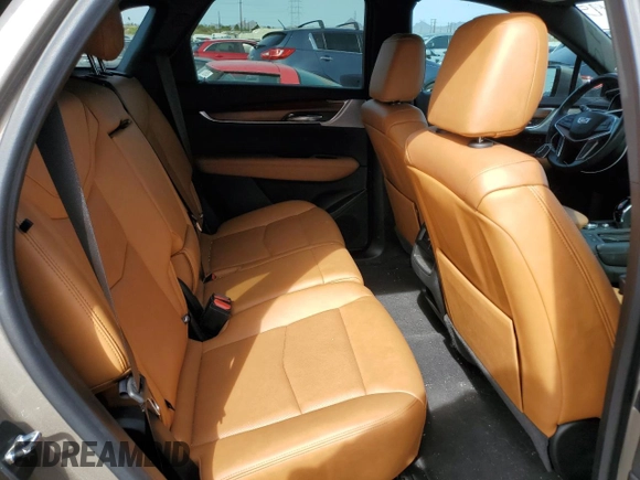 2022 Cadillac XT5 FWD Premium Luxury z VIN 1GYKNCRS9NZ180043, wystawiony jako Copart lot #51352195 z przebiegiem 12 399 mil mil oraz Szkoda całkowita • Salvage title. Historia ofert i sprzedaży dostępna na DreamBid. Obrazek 11.