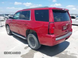 2015 Chevrolet Tahoe LS with VIN 1GNSCAEC4FR121571, listed as a IAAI auction lot 42499156 with 131,284 mi miles and . Bid and sale history available at DreamBid. Image 3.