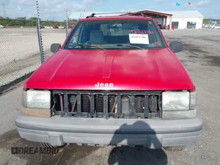 1995 Jeep Grand Cherokee Laredo with VIN 1J4FX58S9SC686074, listed as a IAAI auction lot 42451786 with 82,249 mi miles and . Bid and sale history available at DreamBid. Image 6.