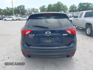 2014 Mazda CX-5 Grand Touring with VIN JM3KE2DY8E0425258, listed as a IAAI auction lot 42179452 with 132,137 mi miles. Bid and sale history available at carsss.com. Image 16.