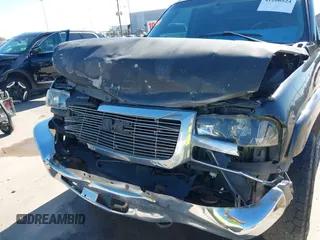 2003 GMC Sierra 1500HD SLE z VIN 1GTGC13U53F203980, wystawiony jako IAAI lot #41206524 z przebiegiem 309 414 mil mil oraz . Historia ofert i sprzedaży dostępna na DreamBid. Obrazek 6.