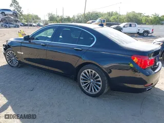 2012 BMW 7 Series 740i with VIN WBAKA4C51CC613636, listed as a IAAI auction lot 41908801 with 127,725 mi miles. Bid and sale history available at carsss.com. Image 3.