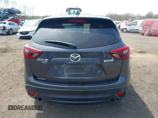 2016 Mazda CX-5 Grand Touring z VIN JM3KE4DY1G0893119, wystawiony jako IAAI lot #42049614 z przebiegiem 102 506 mil mil oraz . Historia ofert i sprzedaży dostępna na DreamBid. Obrazek 16.