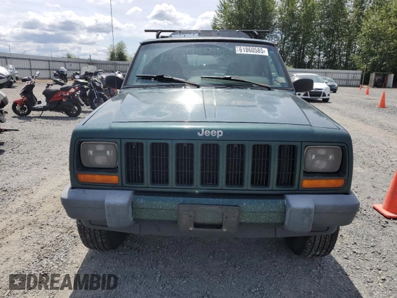 1999 Jeep Cherokee Sport with VIN 1J4FF68S2XL570795, listed as a Copart auction lot 61860585 with 320,467 mi miles and Salvage title. Bid and sale history available at DreamBid. Image 5.
