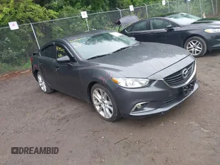 2014 Mazda 6 i Touring with VIN JM1GJ1V69E1158854, listed as a IAAI auction lot 42456112 with 145,078 mi miles and . Bid and sale history available at DreamBid. Image 1.