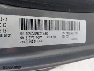 2012 Dodge Caliber SXT with VIN 1C3CDWDA6CD510605, listed as a IAAI auction lot 42104688 with 221,059 mi miles. Bid and sale history available at carsss.com. Image 9.