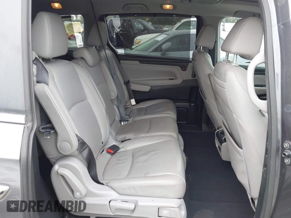 2018 Honda Odyssey Touring with VIN 5FNRL6H88JB062213, listed as a IAAI auction lot 42489379 with 90,578 mi miles and . Bid and sale history available at DreamBid. Image 8.