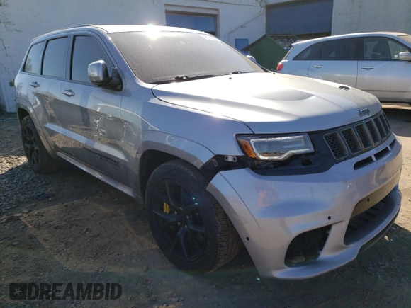 2018 Jeep Grand Cherokee with VIN NJ1454E, listed as a Copart auction lot 48051693 with 66,894 mi miles and Salvage title. Bid and sale history available at DreamBid. Image 4.