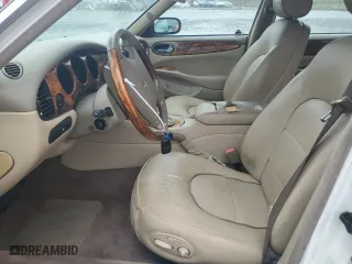 1999 Jaguar XJ with VIN SAJKX6049XC858040, listed as a Copart auction lot 64894604 with 218,054 mi miles and Salvage Title. Bid and sale history available at carsss.com. Image 7.