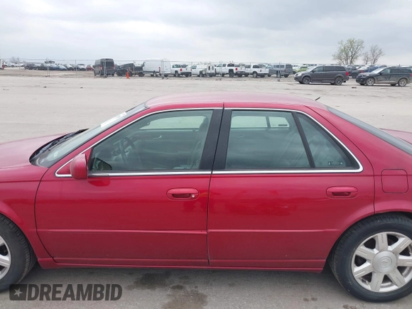 2001 Cadillac Seville z VIN 1G8KS54Y91U227846, wystawiony jako IAAI lot #42134095 z przebiegiem 216 766 mil mil oraz . Historia ofert i sprzedaży dostępna na DreamBid. Obrazek 14.