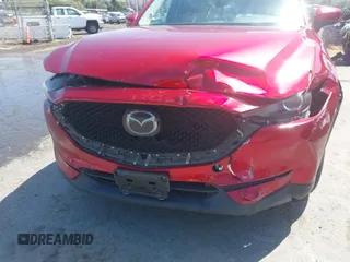 2019 Mazda CX-5 Touring with VIN JM3KFACM5K1516242, listed as a IAAI auction lot 42019803 with 113,953 mi miles. Bid and sale history available at carsss.com. Image 6.