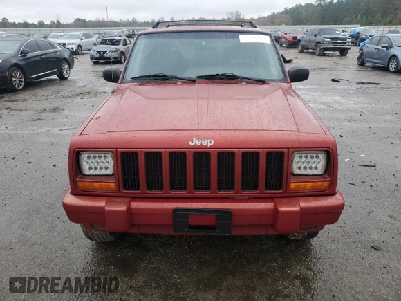 1999 Jeep Cherokee Sport with VIN 1J4FT68S1XL601799, listed as a Copart auction lot 83881844 with 203,572 mi miles and Salvage title. Bid and sale history available at DreamBid. Image 5.