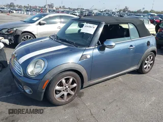 2010 MINI Convertible with VIN WMWMR3C53ATU97865, listed as a IAAI auction lot 41610670 with 154,457 mi miles and . Bid and sale history available at DreamBid. Image 2.