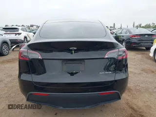 2023 Tesla Model Y Long Range with VIN 7SAYGDEEXPA044335, listed as a IAAI auction lot 42350159 with 26,731 mi miles and . Bid and sale history available at DreamBid. Image 17.
