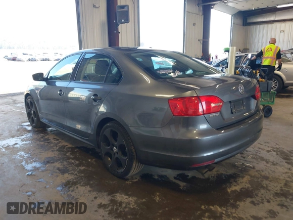 2014 Volkswagen Jetta Sedan S with VIN 3VW2K7AJ5EM410491, listed as a IAAI auction lot 42083614 with 65,960 mi miles. Bid and sale history available at carsss.com. Image 3.