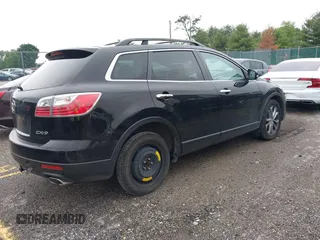 2012 Mazda CX-9 Grand Touring z VIN JM3TB2DAXC0338667, wystawiony jako IAAI lot #42260820 z przebiegiem 138 111 mil mil oraz . Historia ofert i sprzedaży dostępna na DreamBid. Obrazek 4.