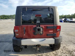 2010 Jeep Wrangler Unlimited Sahara with VIN 1J4BA5H13AL141851, listed as a Copart auction lot 63486504 with 0 mi miles and Salvage Title. Bid and sale history available at carsss.com. Image 6.