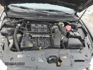 2013 Ford Taurus Limited z VIN 1FAHP2F80DG216618, wystawiony jako Copart lot #85572994 z przebiegiem 185 697 mil mil oraz Szkoda całkowita • Salvage title. Historia ofert i sprzedaży dostępna na DreamBid. Obrazek 11.