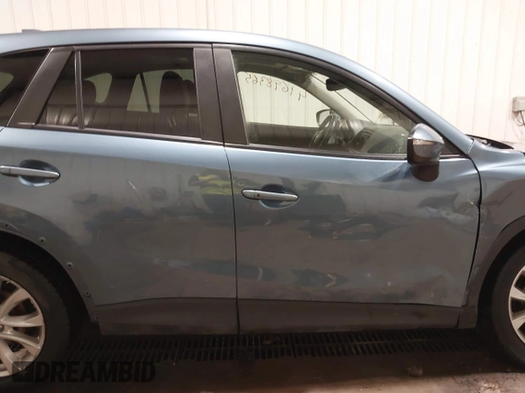 2015 Mazda CX-5 Grand Touring with VIN JM3KE4DY7F0504398, listed as a IAAI auction lot 41698365 with 122,121 mi miles. Bid and sale history available at carsss.com. Image 13.