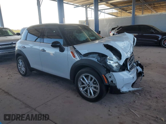 2015 MINI Countryman with VIN WMWZB3C50FWR45253, listed as a Copart auction lot 63608655 with 123,701 mi miles and Salvage title. Bid and sale history available at DreamBid. Image 4.