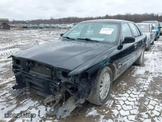 2010 Mercury Grand Marquis LS with VIN 2MEBM7FV5AX631935, listed as a IAAI auction lot 41726717 with 124,139 mi miles. Bid and sale history available at carsss.com. Image 2.