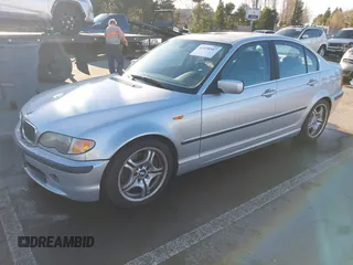 2003 BMW 3 Series 330i with VIN WBAEV53463KM29698, listed as a IAAI auction lot 41528947 with 204,400 mi miles. Bid and sale history available at carsss.com. Image 2.