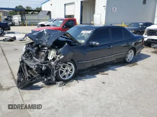 2001 Mercedes-Benz E-Class AWD with VIN WDBJF82J21X056553, listed as a Copart auction lot 73046694 with 0 mi miles and Salvage Title. Bid and sale history available at carsss.com. Image 1.