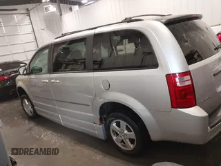 2010 Dodge Grand Caravan SXT with VIN 2D4RN5D15AR261319, listed as a IAAI auction lot 41877022 with 142,292 mi miles and . Bid and sale history available at DreamBid. Image 14.