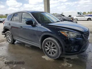 2016 Mazda CX-5 Touring with VIN JM3KE2CY9G0834048, listed as a Copart auction lot 54491535 with 116,328 mi miles and Salvage Title. Bid and sale history available at DreamBid. Image 4.