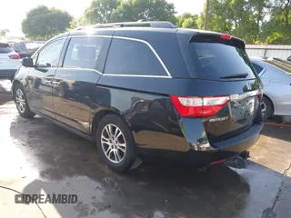 2013 Honda Odyssey EX-L with VIN 5FNRL5H6XDB090768, listed as a IAAI auction lot 42008759 with 116,052 mi miles and . Bid and sale history available at carsss.com. Image 3.