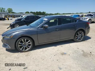 2016 Mazda 6 i Grand Touring z VIN JM1GJ1W59G1486381, wystawiony jako Copart lot #52010535 z przebiegiem 65 369 mil mil oraz Szkoda całkowita • Salvage title. Historia ofert i sprzedaży dostępna na DreamBid. Obrazek 1.