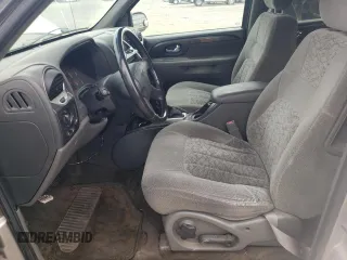2003 GMC Envoy SLE z VIN 1GKDT13S332365071, wystawiony jako Copart lot #52811295 z przebiegiem Nie podano mil oraz Szkoda całkowita • Salvage title. Historia ofert i sprzedaży dostępna na DreamBid. Obrazek 7.