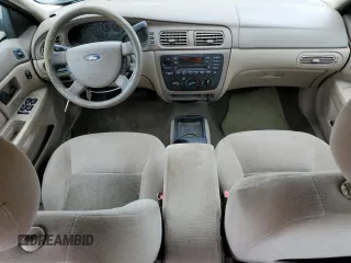 2006 Ford Taurus SE z VIN 1FAFP53U16A142612, wystawiony jako Copart lot #59805145 z przebiegiem 116 999 mil mil oraz Czysty tytuł • Clean title. Historia ofert i sprzedaży dostępna na DreamBid. Obrazek 8.