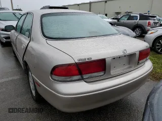 1993 Mazda 626 z VIN 1YVGE22B9P5208685, wystawiony jako Copart lot #73931064 z przebiegiem 91 446 mil mil oraz Nie do naprawy. Historia ofert i sprzedaży dostępna na DreamBid. Obrazek 6.