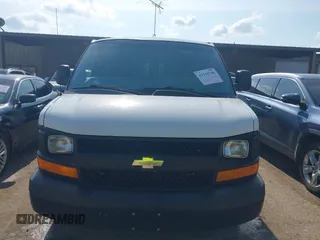 2014 Chevrolet Express Cargo Van with VIN 1GCWGFCG0E1100859, listed as a IAAI auction lot 42142748 with 182,900 mi miles. Bid and sale history available at carsss.com. Image 12.