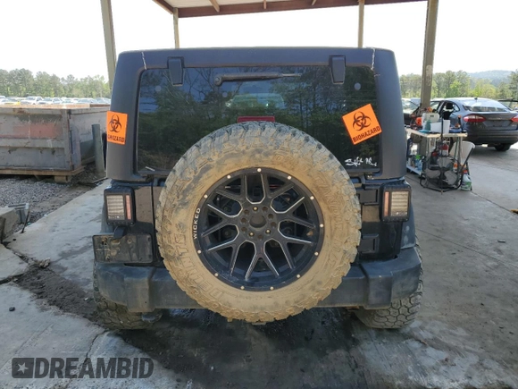 2011 Jeep Wrangler Unlimited Sport with VIN 1J4HA3H19BL574932, listed as a Copart auction lot 53250465 with 113,344 mi miles and Salvage Title. Bid and sale history available at carsss.com. Image 6.