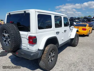 2021 Jeep Wrangler Unlimited Rubicon with VIN 1C4HJXFN9MW519496, listed as a IAAI auction lot 41676845 with 72,767 mi miles. Bid and sale history available at carsss.com. Image 4.