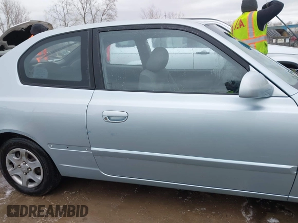 2003 Hyundai Accent GL with VIN KMHCG35C23U264360, listed as a IAAI auction lot 42033316 with 100,991 mi miles. Bid and sale history available at carsss.com. Image 13.