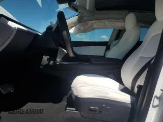 2022 Tesla Model Y Performance with VIN 7SAYGDEF9NF372337, listed as a Copart auction lot 55889345 with 51,099 mi miles and Salvage title. Bid and sale history available at DreamBid. Image 7.