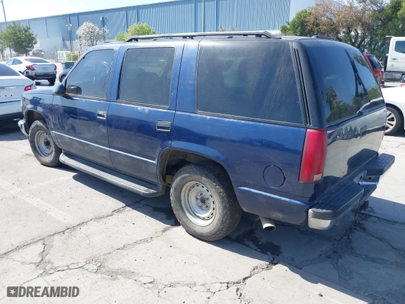 1999 Chevrolet Tahoe with VIN 1GNEC13R7XJ573387, listed as a IAAI auction lot 42001191 with 241,007 mi miles. Bid and sale history available at carsss.com. Image 3.