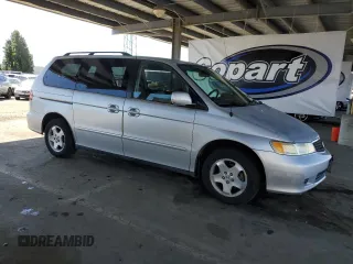 2001 Honda Odyssey EX z VIN 2HKRL18601H559033, wystawiony jako Copart lot #57119025 z przebiegiem 333 068 mil mil oraz Szkoda całkowita • Salvage title. Historia ofert i sprzedaży dostępna na DreamBid. Obrazek 4.