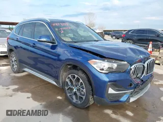 2021 BMW X1 xDrive28i with VIN WBXJG9C07M5T98125, listed as a IAAI auction lot 41878718 with 34,331 mi miles. Bid and sale history available at carsss.com. Image 1.