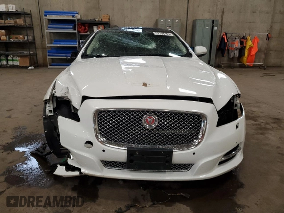 2014 Jaguar XJ Portfolio with VIN SAJWJ2GD2E8V69597, listed as a Copart auction lot 57798145 with 100,857 mi miles and Salvage title. Bid and sale history available at DreamBid. Image 5.