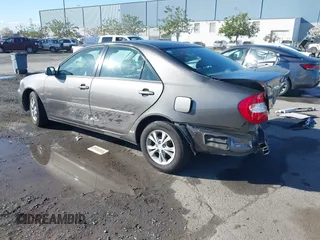 2004 Toyota Camry LE with VIN 4T1BF30K94U577260, listed as a IAAI auction lot 41906287 with 68,499 mi miles. Bid and sale history available at carsss.com. Image 3.