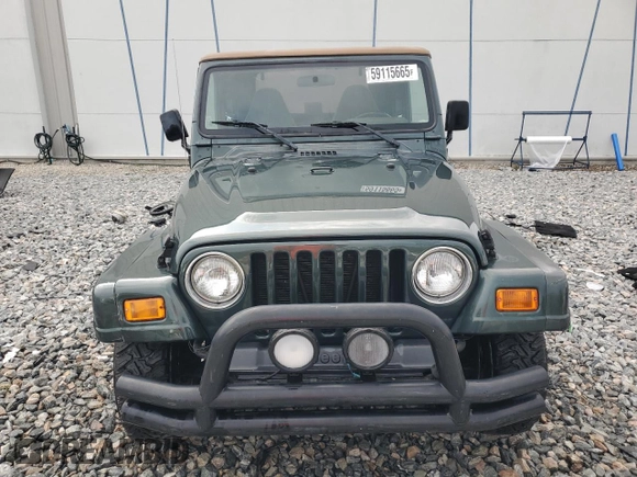 2002 Jeep Wrangler Sahara with VIN 1J4FA59S52P763290, listed as a Copart auction lot 59115665 with 129,479 mi miles and Non repairable. Bid and sale history available at DreamBid. Image 5.