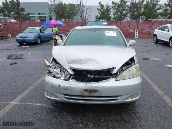 2004 Toyota Camry LE with VIN 4T1BF32K84U589638, listed as a IAAI auction lot 41571339 with 90,311 mi miles. Bid and sale history available at carsss.com. Image 12.